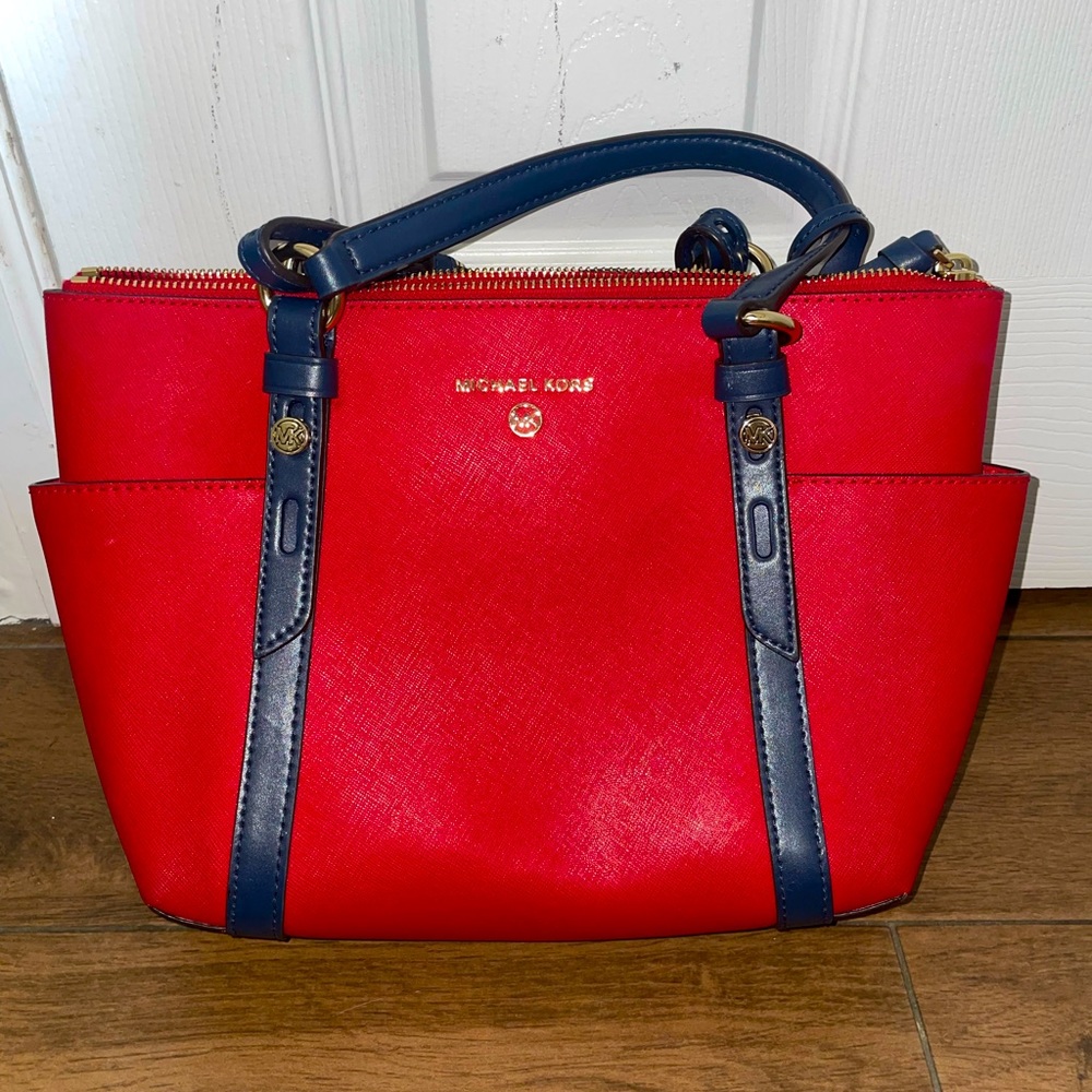 Red Michael kors bag no damage.